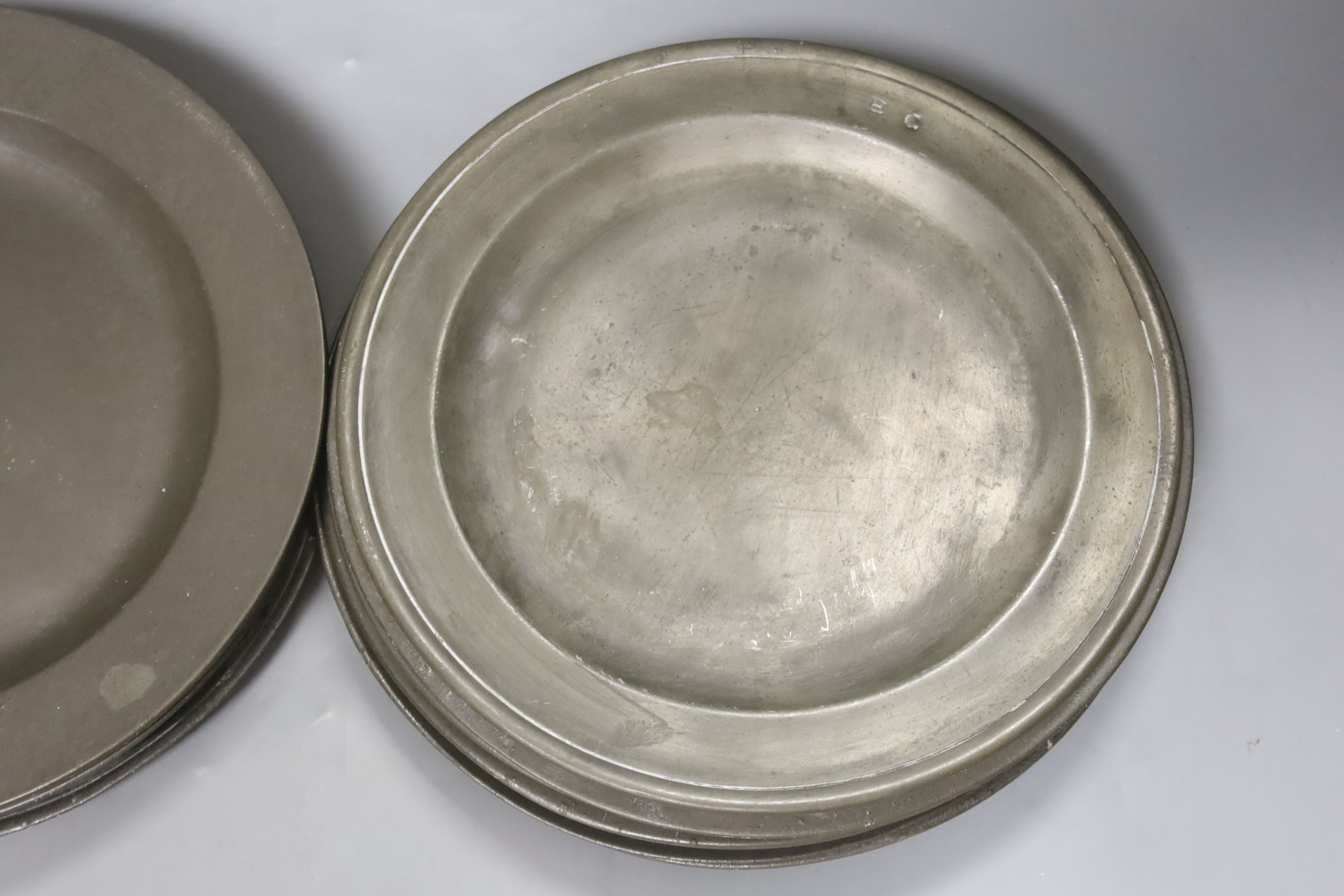 A quantity of 18th century pewter plates, London touch marks diameter 24cm